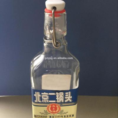 China Chinese Bottle Cap Vodka With Swing Top Cap for sale