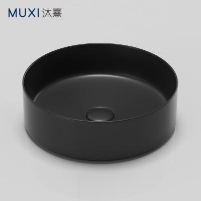 China Matt Black Color Hand Wash Basin Modern Round Countertop Ceramic Sink Matt Black Art Basin Bathroom Bathroom Sink For Hotel for sale