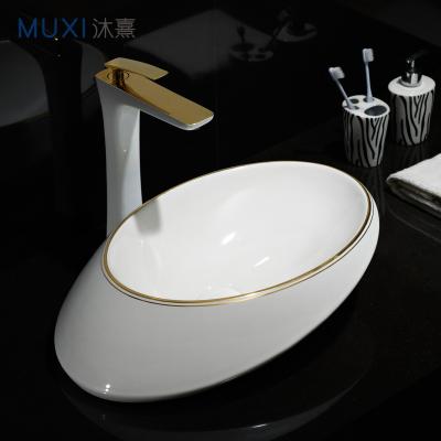 China Luxury Luxury Oval Gold Line Gold Line Gold White Bathroom Basin Art Basin Golden Line Color Wash Basin For Hotel for sale