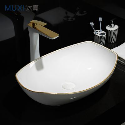 China Best Selling Luxury Gold Line Art Basin Golden Line White color sink sink counter top ceramic washbasin for hotel for sale