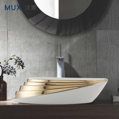 China Art Basin Golden Color Hand Wash Basin New Design Luxury Modern Oval Gold Color Wash Basin for Hotel for sale