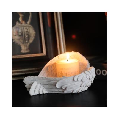 China D5cm Creative Home Decor Angel Feather Wings Resin Candle Holder With Candle for sale