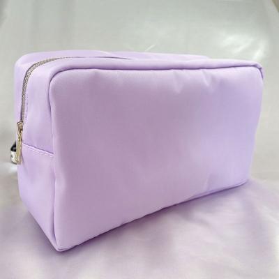 China Wholesale Fabric Stock RTS Colorful Zippered Nylon Waterproof Cosmetic Pouch Small Towel Toiletry Bag Towel Embroidery Logo Jewelry Bag for sale