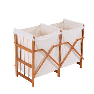 China New Style Modern Household Frame Folding Bamboo Laundry Hamper Clothes Storage Basket Bin With 2 Bags for sale