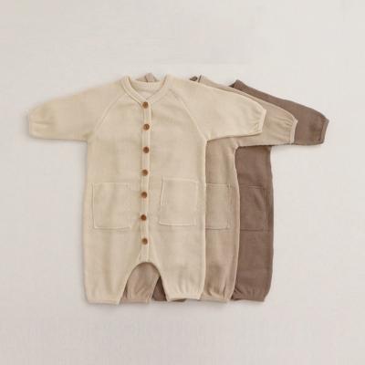 China Hot Selling Cozy Romper Newborn Organic Waffle Tied Cotton Overalls Buttons Oversized Baby Jumpsuit Kids Set Clothes Buckle for sale