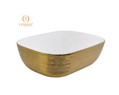 China Modern Luxury style electroplating gold design bathroom and hotel design sanitary ware art basin top sink basin for sale