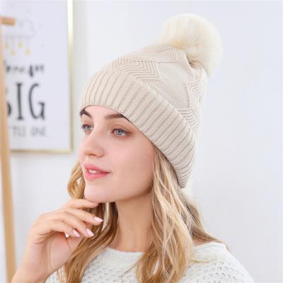 China Wholesale COMMON Winter Knitted Skullies Beanies Women Knit Beanie Chunky Pompom Winter Wool Knitted Slouchy Hat for sale