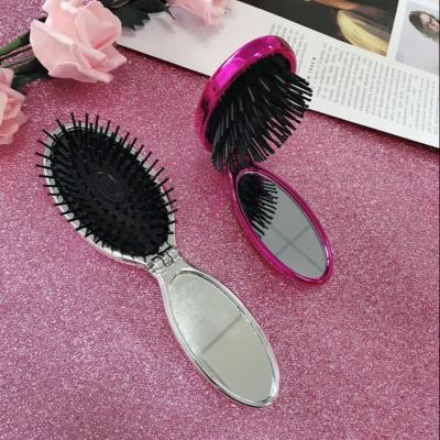 China Compact Portable Round Pocket Travel Massage Folding Comb Girl Small Size Hair Brush With Mirror Styling Tools for sale