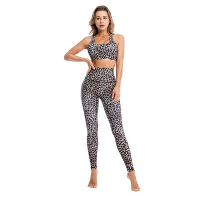 China Custom fast delivery seamless logo new sports and fitness suit women leopard print yoga pants cross back bra set yoga suit for sale