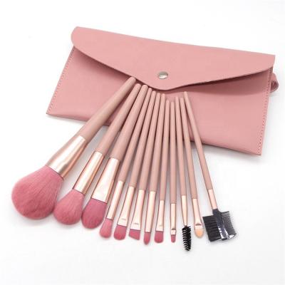 China Angular Blush 12 Pieces Pink Internet Celebrity Makeup Brush Set With Wooden Handle for sale