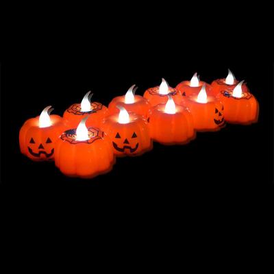 China Battery Operated Glowing Reigniting Candle Pumpkin Ghost Halloween LED Candle Light Party Decoration for sale