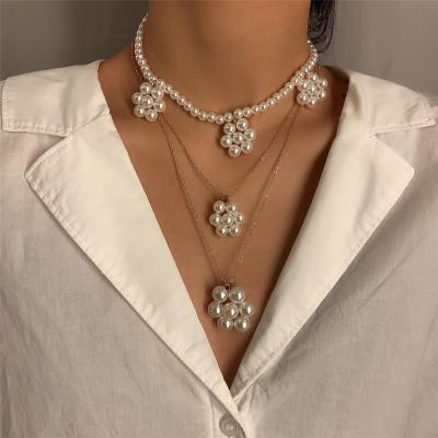 China Long Tassel Pearl Necklace Simple Handmade Geometric Imitation Flower Pearl Necklace for sale