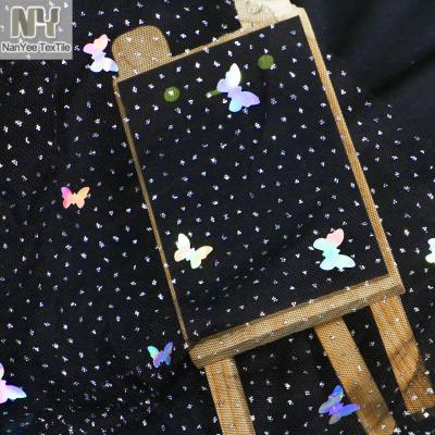 China Sheer Black Shiny Stretch Nanyee Textile Butterfly Glitter Tulle Fabric for sale