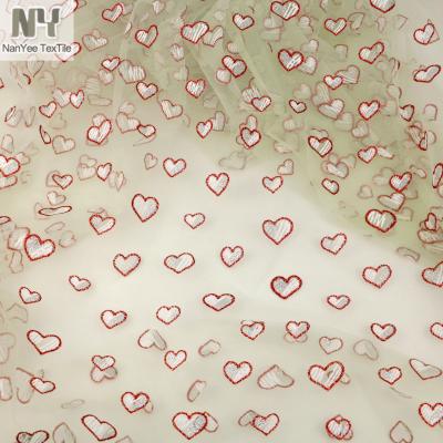 China Stretch Nanyee Textile Foil Style Broken Heart Printed Glitter Mesh Fabric for sale