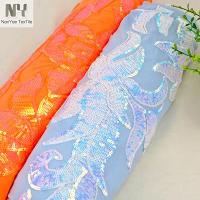 China Nanyee Micro Fluorescent Textile 3mm Blue Iridescent Sequin Embroidered On Power Mesh for sale