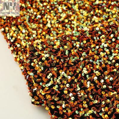 China Heavy Bright Orange Neon Stretch Nanyee Textile Velvet Sequin Fabric for sale