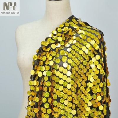 China Large Gold Fluorescent Hologram Textile 18mm Nanyee Sequin Embroidered Fabric On Stretch Mesh for sale