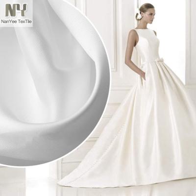 China Nanyee Fluorescent Textile Wholesale Polyester Matte Duchess Bridal Satin Fabric On Wedding Dress for sale