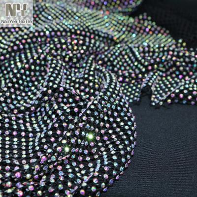 China Nanyee Sustainable Textile Bling High End Elastic Mesh Fabric With Crystal Foiled Hole In Placement for sale