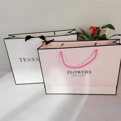 China Handmade Custom Luxury Garment Gift Paper Shopping Bags with Logo Print for sale