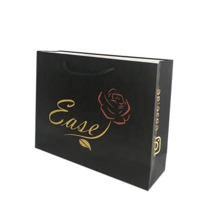 China Custom Retail Handmade Logo Clothing Packaging Black Paper Shopping Bag Gift Cosmetic Paper Bag for sale