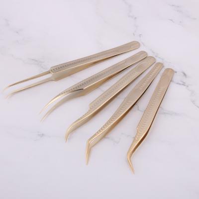 China Custom Eyelash Extension Tools Worldbeauty Logo Gold Fashion Eyelash Extensions Tweezers for sale