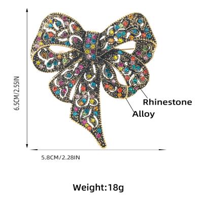 China New popular fashionable alloy diamond-studded bow brooch girl cute brooch bodice dress clothing brooch for sale