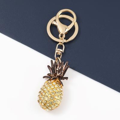 China Beautiful luxury boutique pineapple girl hot sale rhinestone diamond-studded key chain key chain for bags for sale