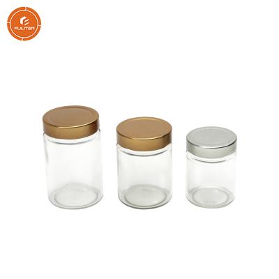 China Empty Clear Glass Food Cylinder 12oz Seal Storage Jar Honey Bottle With Cap for sale