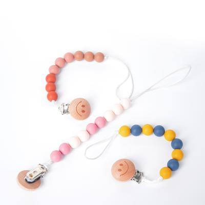 China 100%food grade Silicone Teether Hot Sale Baby Toy Wooden Pram Clip Baby Mobile Pram customize silicone pearl cloud pacifier chain for sale