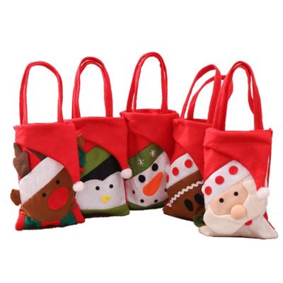 China Eco-friendly Christmas Themed Bags Red Nonwoven Felt Small Santa Kids Christmas Gift Velvet Tote Bag Christmas Shopping Gift for sale