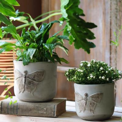 China New Minimalist Modern Design Balcony Decorative Concrete Pots Butterfly Embossed Cement Pots For Garden for sale