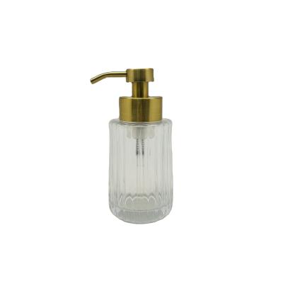 China Vertical Stripe Clear Glass Foaming Lotion Pump Foaming Hand Dispenser With Mat Gold Pump Head for sale