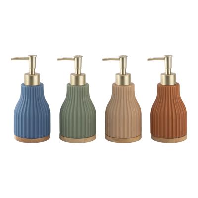 China Round Bath Soap Dispenser Ceramic Lotion Dispenser Vertical Stripe With Wood Base for sale