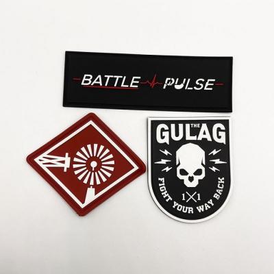 China Sustainable Customized 2D Rubber Apparel Brand Logo Badges PVC Rubber Labels for sale