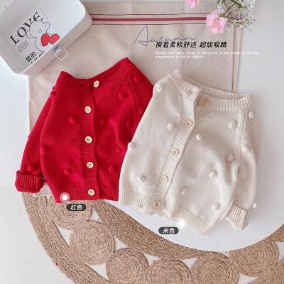 China Anti-pilling latest new design cute cotton knitted sweaters baby cardigan with pom pom for sale