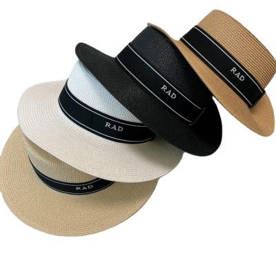 China Luxury brand version crossed out correct letter P inverted triangle straw hat fashion beach sun shade flat straw hat for sale