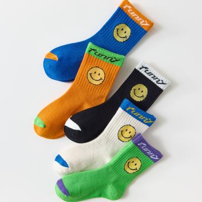 China 2021 Autumn Color Trend Baby Tube Luminous Socks Breathable Unisex Smiling Warm Socks For 1-12 Years Custom Organic Socks for sale