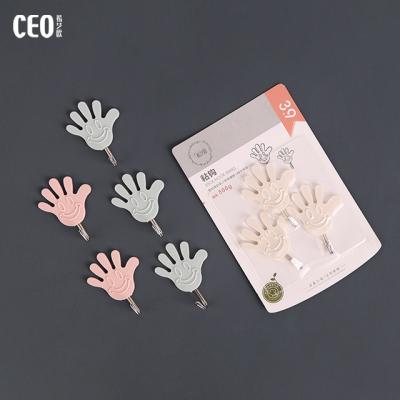 China Sustainable Hot Selling Hand Shape Funny Plastic Adhesive Hook for sale