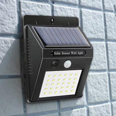 China Polycarbonate 30LED Outdoor Waterproof Energy Saving Yard Path Solar Power PIR Motion Sensor Wall Light Home Solar Led Garden Street Lamp for sale