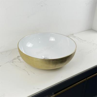 China Modern gold round sink Bano Lavabo  countertop bathroom ceramic art hand wash basin gold color for sale