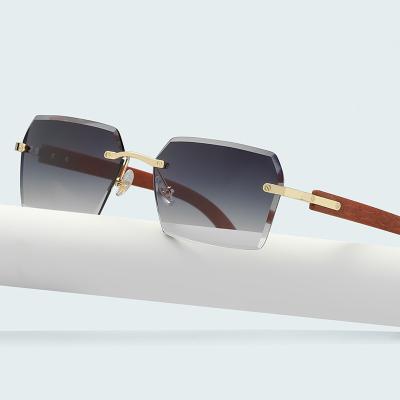 China Fashion Sunglasses 2023 Men New Wood Grain Color Buffalo Horn Shape Fashion Small Square Sun Shades Glasses Trendy Rimless Sunglasses for sale