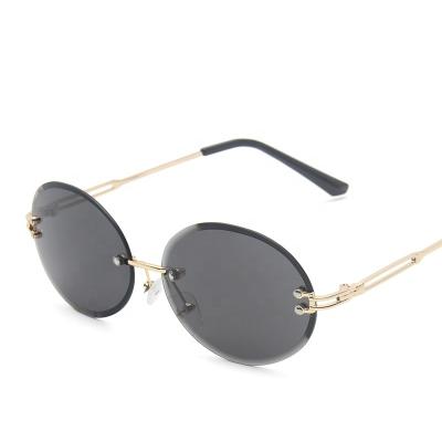 China Fashion Sunglasses 2023 Hot Sale Women Trendy Sun Glasses Round Rimless Shades Sunglasses for Women Gafas De Sol De Mujer for sale