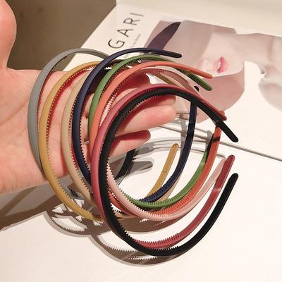 China Decorate Hard Plastic Cheap Makeup Girls Headbands Thin Hair Band With Teeth for sale