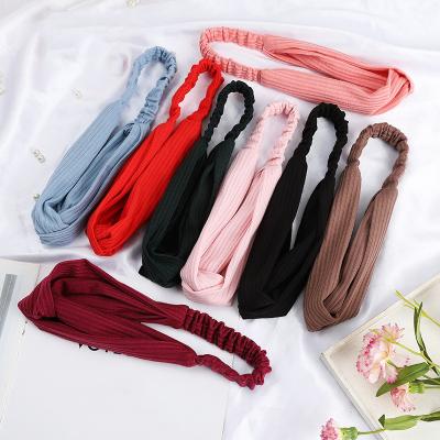 China Hot Face Wash Women Solid Color Elastic Hair Cross Band Twisted Turban Wrap Headbands for sale