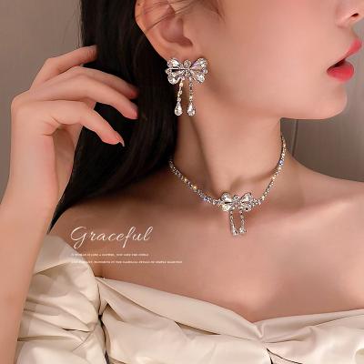 China 2022 Romantic Best Selling Crystal Bow Diamond Bow Necklace Earrings Headband Ornament Set For Ladies for sale