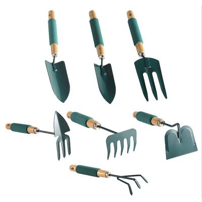 China Eco-Friendly Garden Tool Kit 7 Pieces Outdoor Heavy Duty Carbon Steel Gardening Tools With Handle Wooden DIY Tools Tool Kit For Men Women Gifts for sale