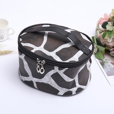 China Fashion Custom Label Animal Zebra Leopard Deer Skin Waterproof Large Capacity PU Leather Cosmetic Bag for sale