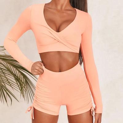 China Custom Made Sexy Twist Breathable Front Sports Crop Tee And Ruched Knot Booty Shorts Set 2021 for sale