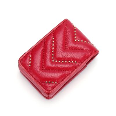 China Fashion Genuine Leather Rivet Makeup Bags Women Durable Lipstick Bag Genuine Leather Cosmetic Bag With Mirror for sale